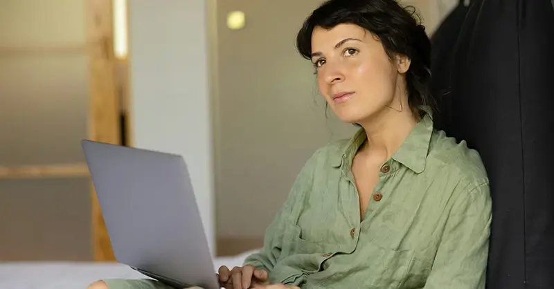 Woman during telehealth call on laptop