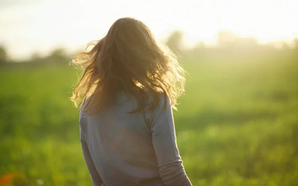 A woman walking in a field