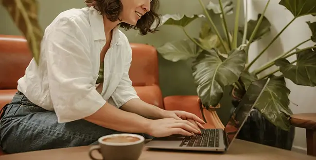 Woman typing on laptop