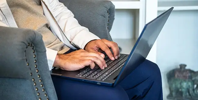 Man typing on laptop