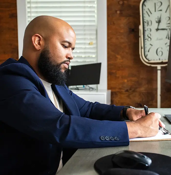 Therapist Terrance writing notes