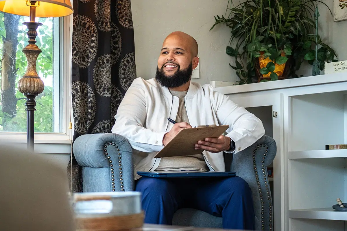 Therapist Terrance talking to client